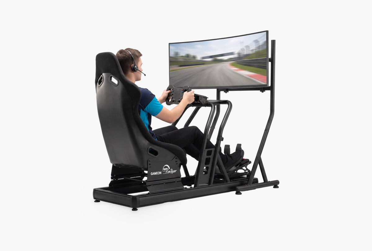 A driver racing on the Hyper Racer with a curved ultrawide screen on its monitor stand