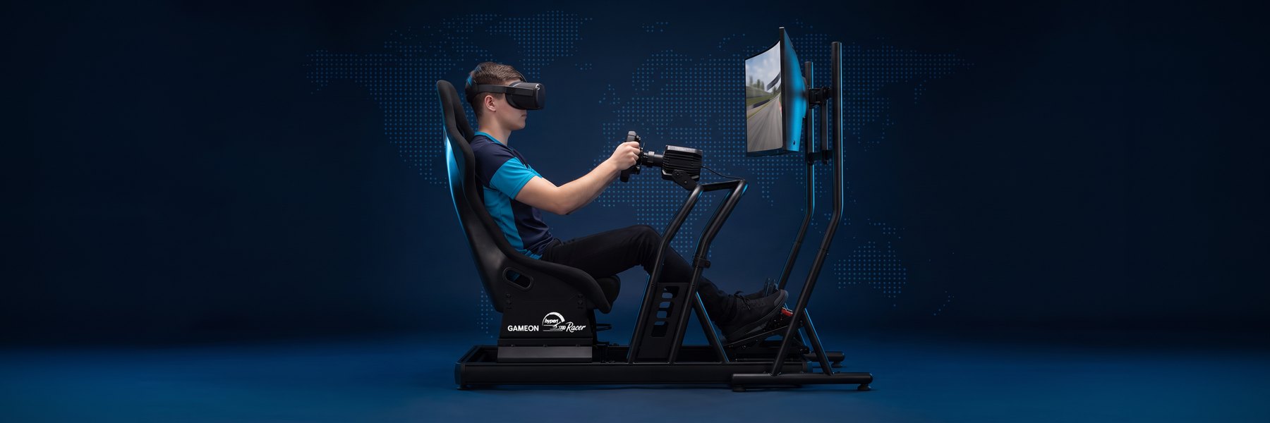 A pro sim racing driver in a VR headset on the Hyper Racer and its ultrawide screen stand, in a navy esports studio